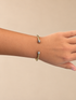 cable cuff bracelet featuring a textured gold-tone design finished with polished silver-tone tips