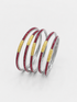 Four stacked silver bangles, each featuring a textured gold center band and a row of small red stones along the outer edge,  UGA Color-Filled Bracelet Set