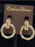 Gold bamboo doorknocker clip-on earrings by LORDANE, INC. featuring a sleek, natural bamboo design and secure clip-on style.