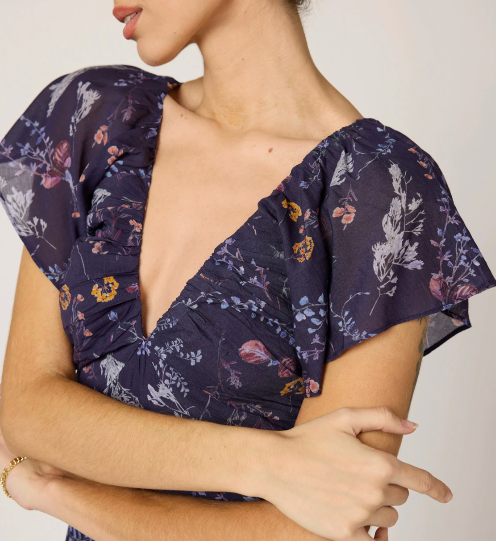 detail shot of woman wearing dark blue dress