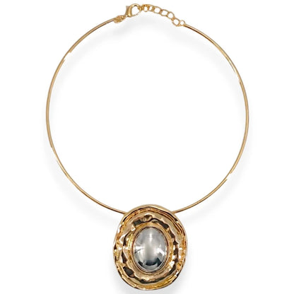 Gold necklace with a pendant on a white background