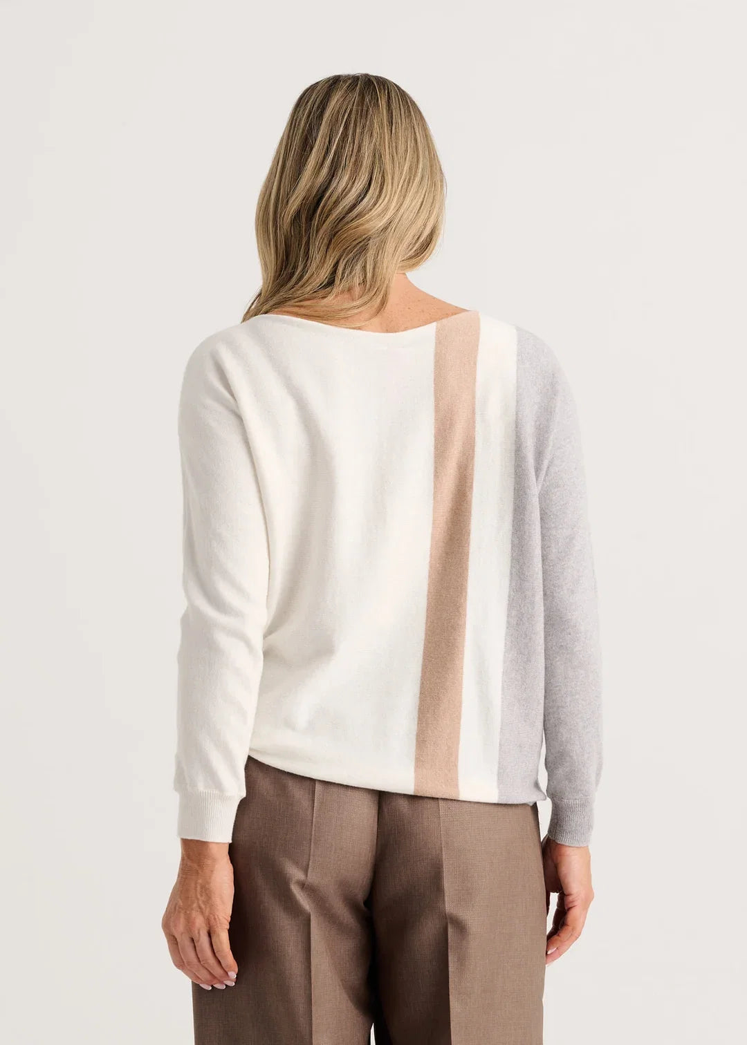 A woman modeling a color-block knit sweater with gray, cream, and beige vertical panels Zaket &amp; Plover Vertical Lines Sweater in Snow