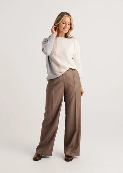 A woman modeling a color-block knit sweater with gray, cream, and beige vertical panels Zaket &amp; Plover Vertical Lines Sweater in Snow