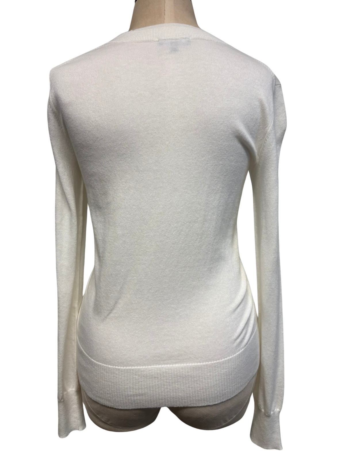 PureAmici crew neck sweater shown from the back, featuring a classic fit and soft knit fabric in a versatile color.