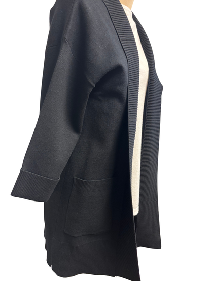 Black cardigan with a white shirt on a white background