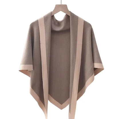 Brown and beige shawl on a hanger against a white background