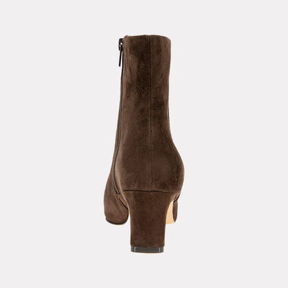 Brown suede ankle boot on a light gray background