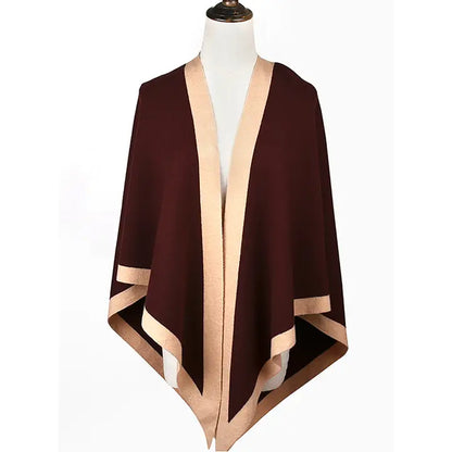 Brown and beige cape on a mannequin against a white background