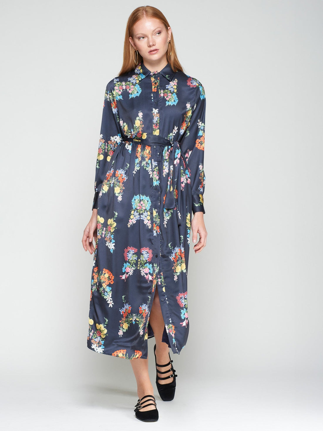 Woman wearing a floral dress on a white background