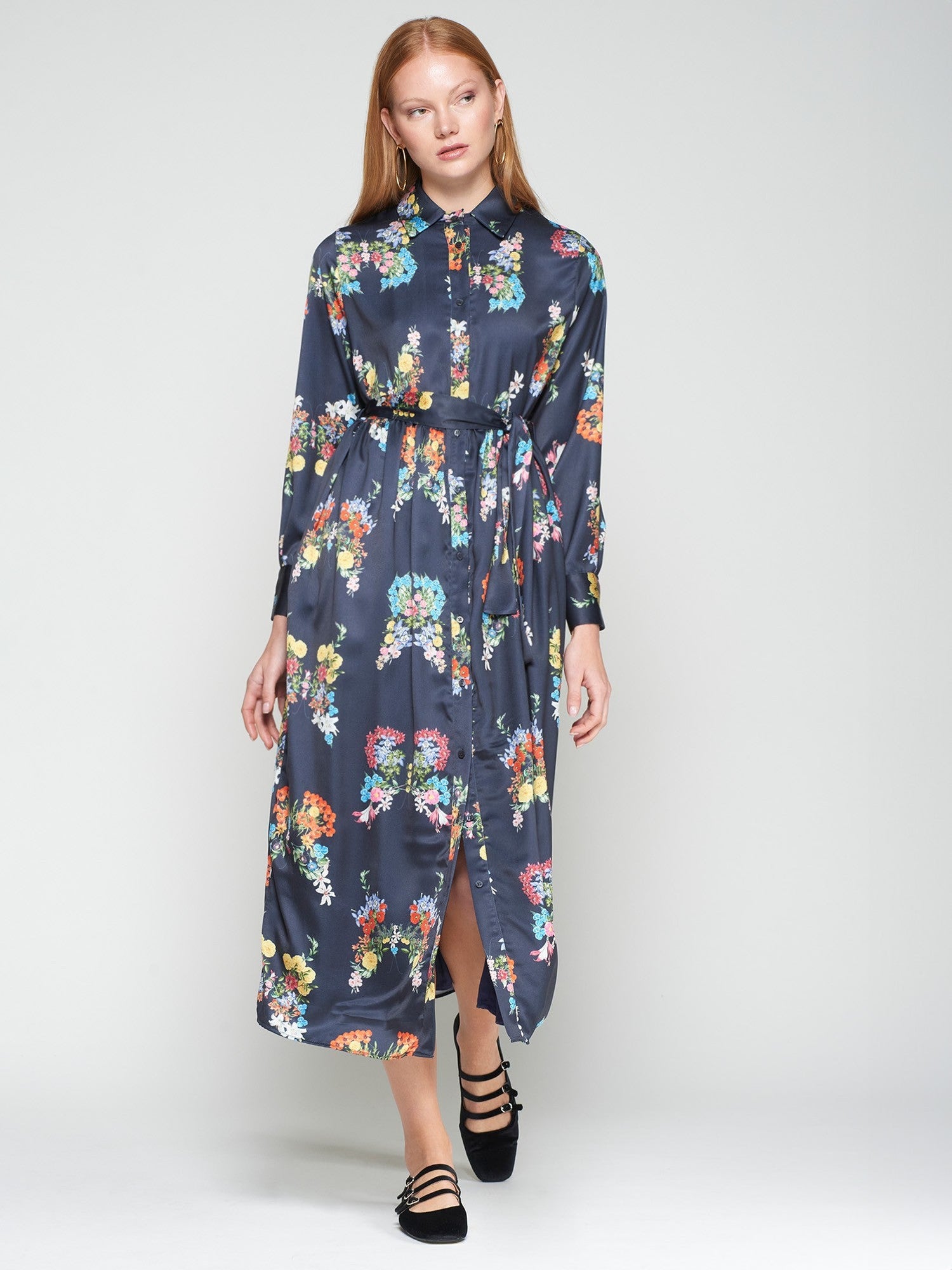 Woman wearing a floral dress on a white background
