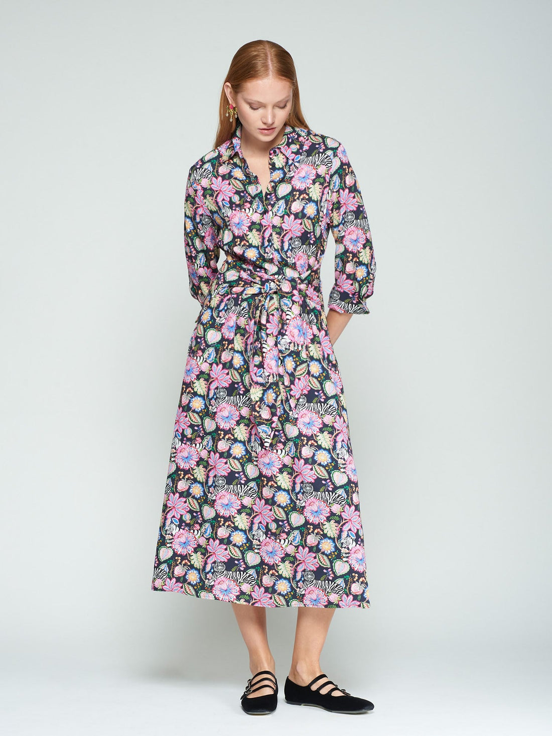 Woman wearing a floral dress on a white background