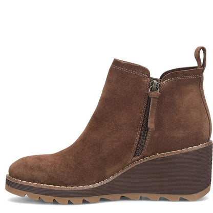 Brown suede ankle boot with a zipper on a white background