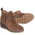 Brown suede wedge ankle boots on a white background