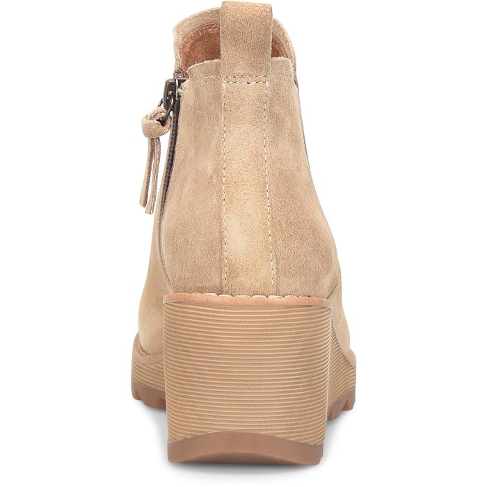Beige ankle boot with platform sole on a white background