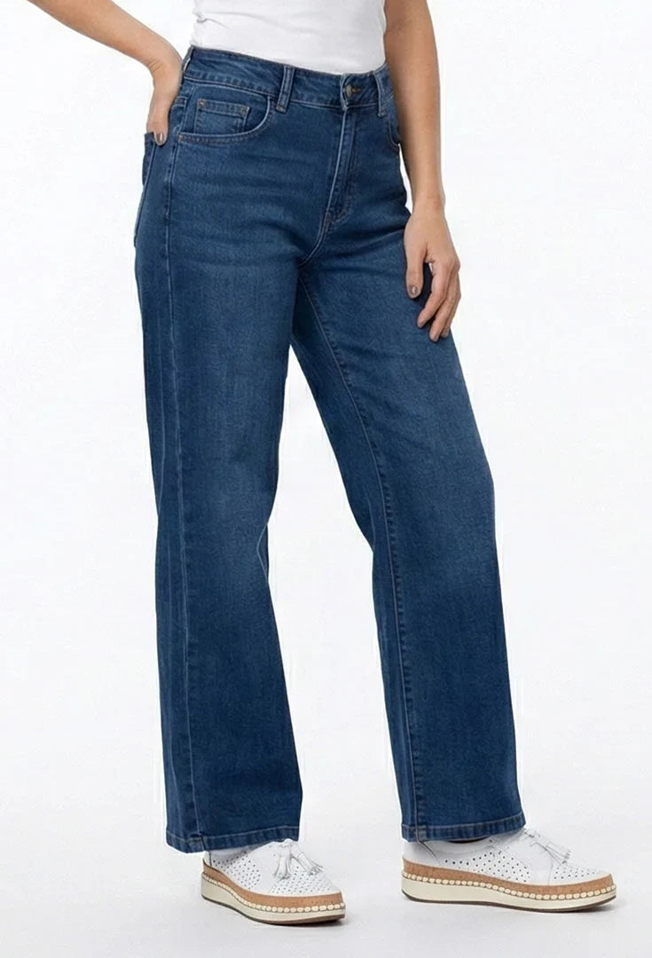 A person wearing dark blue wide-leg jeans, ethyl Relaxed Classic Jean - Benefit Z8MED.AF