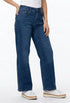 A person wearing dark blue wide-leg jeans, ethyl Relaxed Classic Jean - Benefit Z8MED.AF