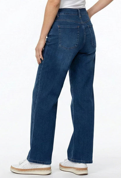 A person wearing dark blue wide-leg jeans, ethyl Relaxed Classic Jean - Benefit Z8MED.AF