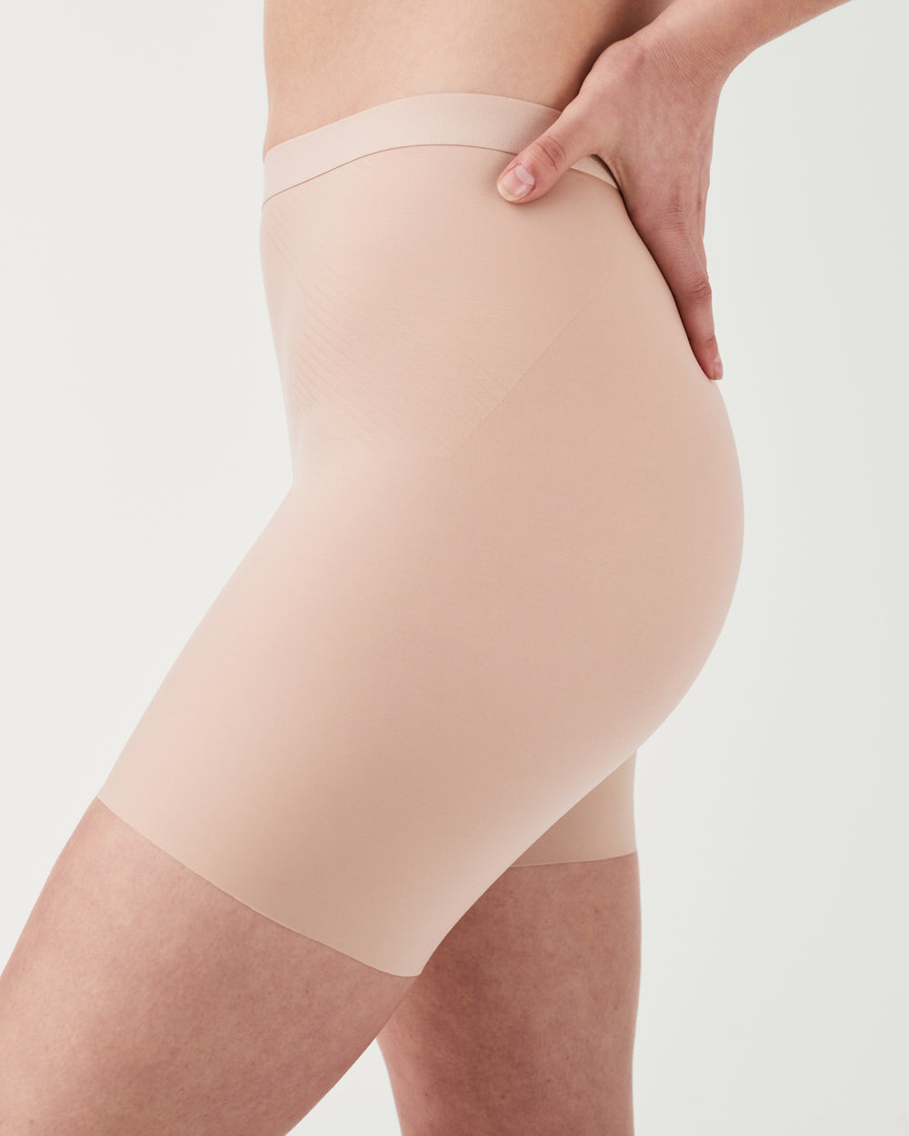 Spanx invisible girlshort lingerie, seamless and lightweight undergarment with smooth fit and breathable fabric.
