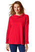 Woman wearing a red blouse with a cowl neck design on a white background