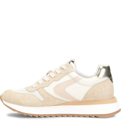 Beige and white sneaker with metallic accents on a white background