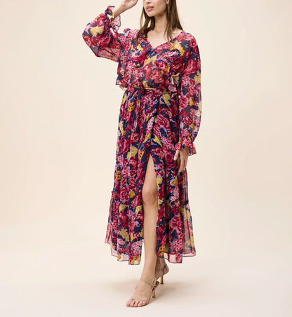 Woman wearing a colorful floral dress on a beige background