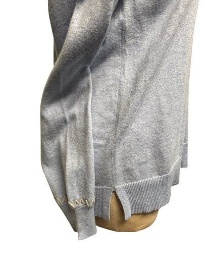Light blue sweater with white stiching on a mannequin with a white background