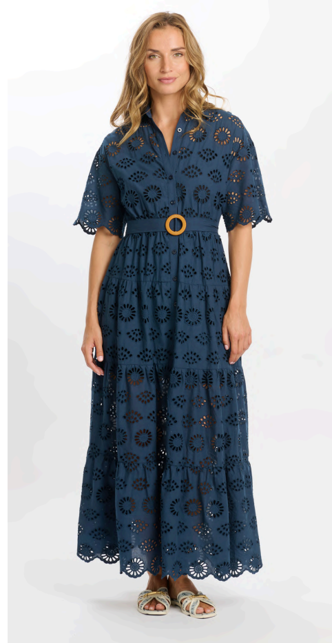 Woman wearing a navy lace dress with a belt on a white background