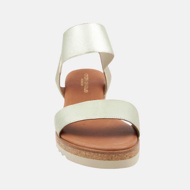 Andre Assous Neveah Metallic Wedge Shoes in platinum with a sleek design and comfortable wedge heel.