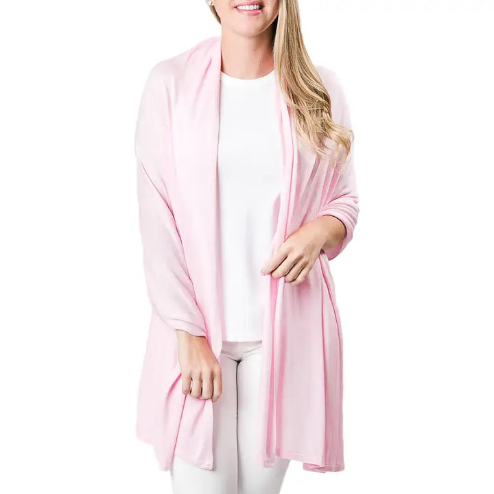 Woman wearing a light pink Ari Bamboo Shawl Wrap