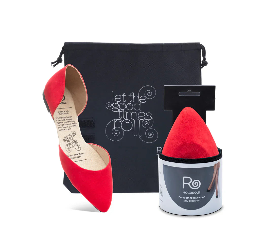 Red pointed-toe shoes with a black pouch and red shoe trees on a white background