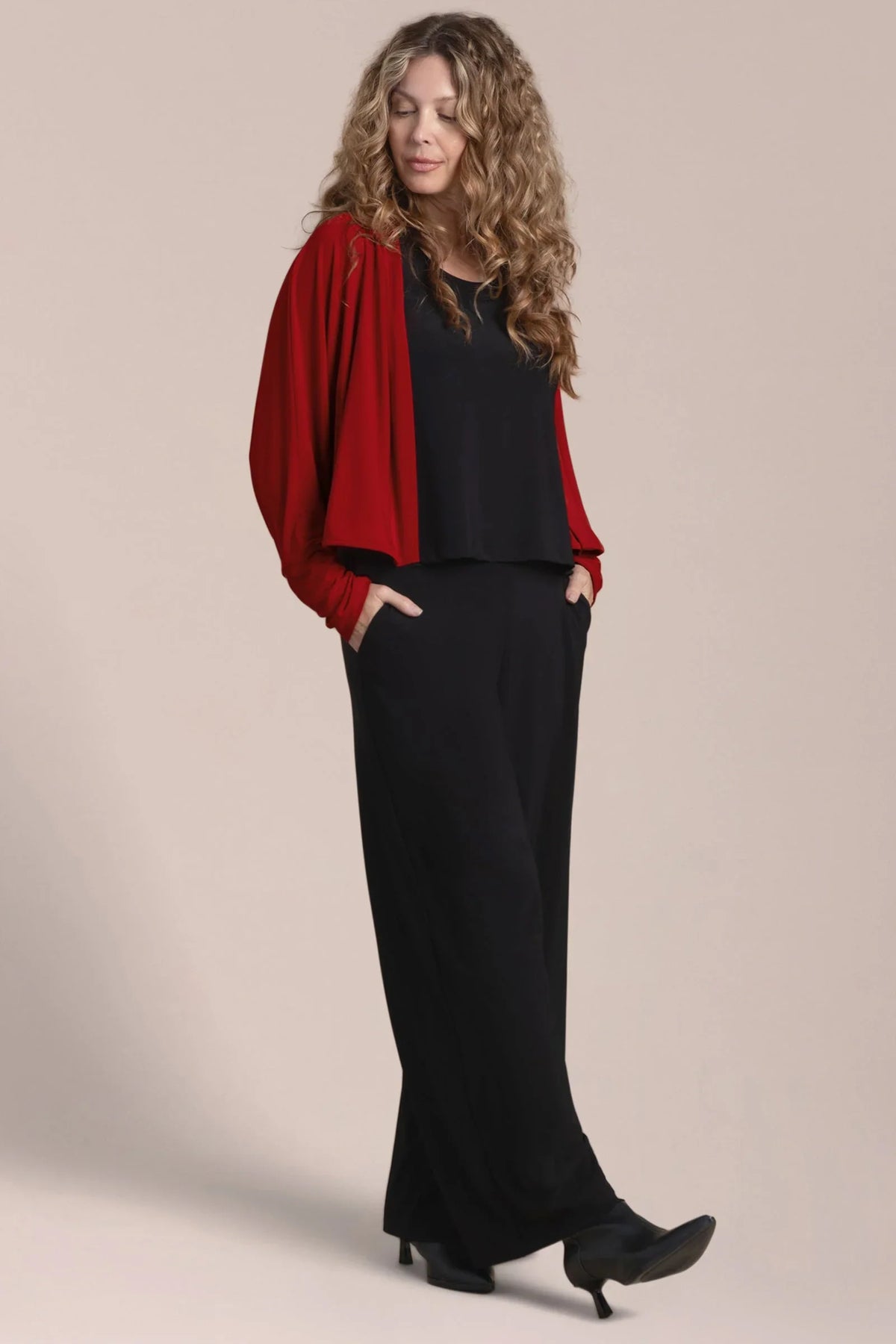 Red honeycomb knit shrug cardigan by SYMPLI, showcasing textured pattern and open front design.