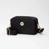 Black crossbody bag with gold accents on a white background