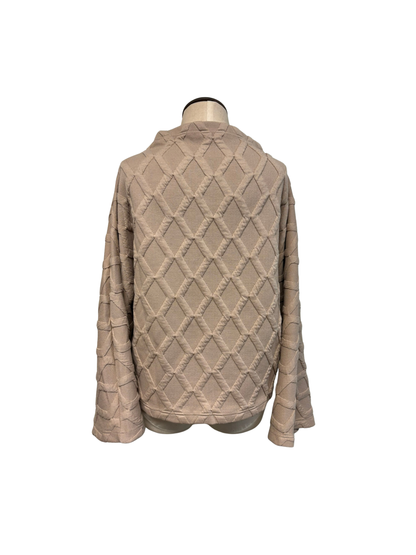 Beige quilted jacket on a mannequin against a white background