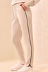 A woman modeling straight-leg pants, featuring thin black side stripes by tribal TECHNO LUX Jogger Pants With Contrast Piping And U-Hem