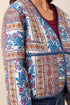 tribal Sharp Reversible Quilt Jacket quilted jacket with a vibrant multicolor paisley and floral pattern in blue, red, and gold.