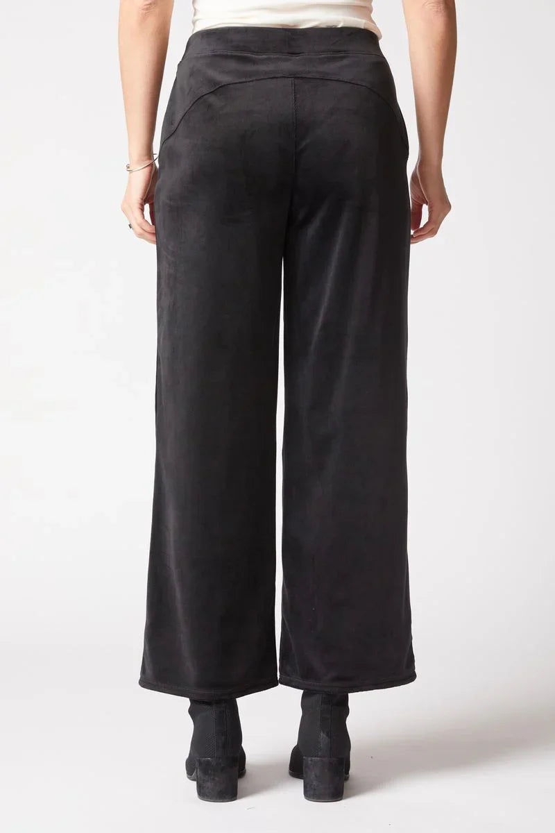 Black wide-leg pants worn by a person on a white background