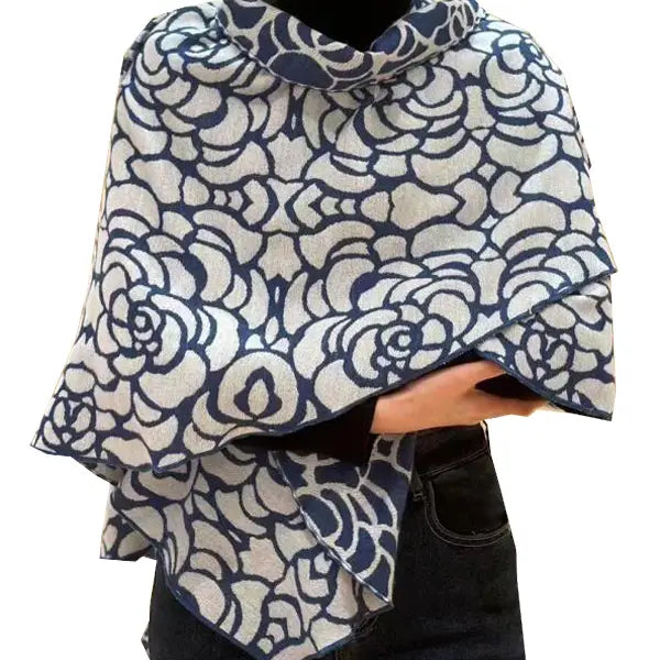 Person wearing a blue and white patterned scarf on a white background